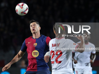 Robert Lewandowski and Loic Bade play during the match between FC Barcelona and Sevilla FC, corresponding to week 10 of LaLiga EA Sports, at...