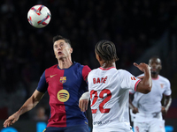 Robert Lewandowski and Loic Bade play during the match between FC Barcelona and Sevilla FC, corresponding to week 10 of LaLiga EA Sports, at...