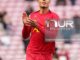 Liverpool's Virgil van Dijk warms up during the Premier League match between Liverpool and Chelsea at Anfield in Liverpool, England, on Octo...