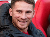 Liverpool's Alexis Mac Allister sits on the bench prior to the Premier League match between Liverpool and Chelsea at Anfield in Liverpool, E...