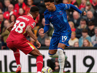 Jadon Sancho of Chelsea is in action with Liverpool's Ryan Gravenberch during the Premier League match between Liverpool and Chelsea at Anfi...