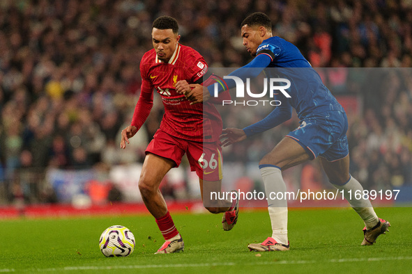 Liverpool's Trent Alexander-Arnold is in action with Chelsea's Levi Colwill during the Premier League match between Liverpool and Chelsea at...