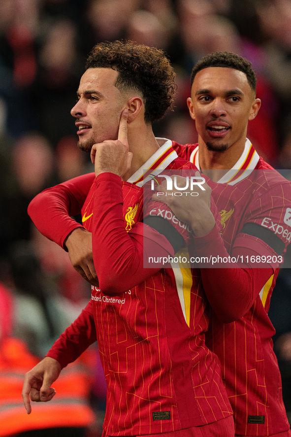 Liverpool's Curtis Jones celebrates with Trent Alexander-Arnold after scoring their second goal during the Premier League match between Live...