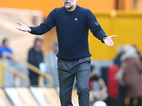 Manchester City's manager Pep Guardiola protests the referee's decision for VAR to check Stones' goal during the Premier League match betwee...