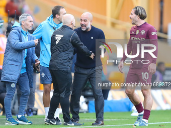 Manchester City's manager Pep Guardiola protests the referee's decision for VAR to check Stones' goal during the Premier League match betwee...