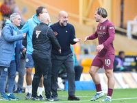 Manchester City's manager Pep Guardiola protests the referee's decision for VAR to check Stones' goal during the Premier League match betwee...