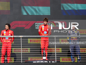 Charles Leclerc, Carlos Sainz Jr., and Max Verstappen stand on the podium during the Formula 1 Pirelli United States Grand Prix 2024 in Aust...