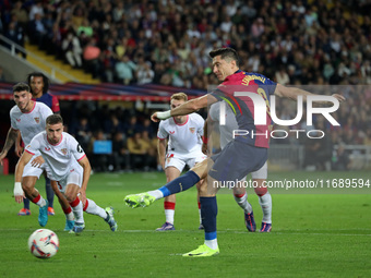 Robert Lewandowski scores a penalty during the match between FC Barcelona and Sevilla FC, corresponding to week 10 of LaLiga EA Sports, at t...