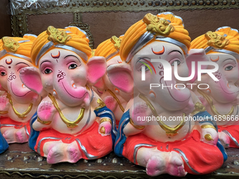 Small earthen idols of Lord Ganesh are displayed at a shop selling puja items in preparation for the festival of Diwali in Mississauga, Onta...