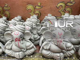 Small earthen idols of Lord Ganesh are displayed at a shop selling puja items in preparation for the festival of Diwali in Mississauga, Onta...