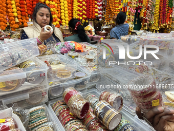 Women purchase bangles in preparation for the festival of Diwali in Mississauga, Ontario, Canada, on October 20, 2024. (