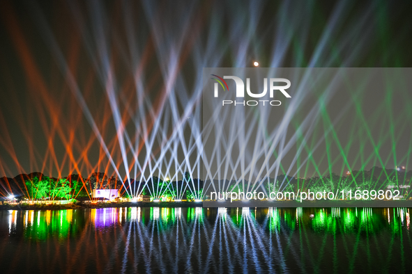 A glimpse of the sound and laser light show at Kankaria Lake reveals various vibrant colors each time it illuminates the night sky. 