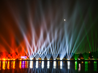 A glimpse of the sound and laser light show at Kankaria Lake reveals various vibrant colors each time it illuminates the night sky. (