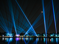 A glimpse of the sound and laser light show at Kankaria Lake reveals various vibrant colors each time it illuminates the night sky. (