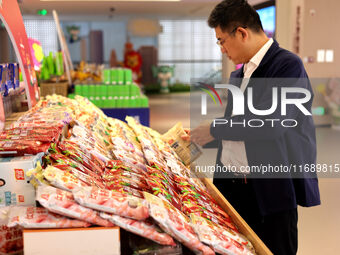 Visitors visit the exhibition hall at Shuanghui Group headquarters in Luohe, China, on October 21, 2024. (