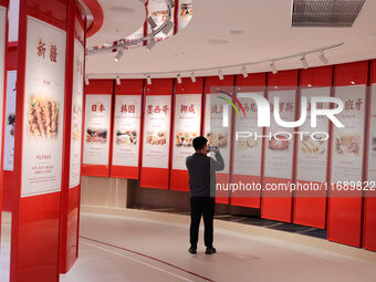 Visitors visit the exhibition hall at Shuanghui Group headquarters in Luohe, China, on October 21, 2024. (