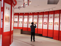 Visitors visit the exhibition hall at Shuanghui Group headquarters in Luohe, China, on October 21, 2024. (