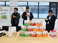 Visitors visit the exhibition hall of the Weilong Spicy snack food intelligent manufacturing project in Luohe, China, on October 21, 2024. (