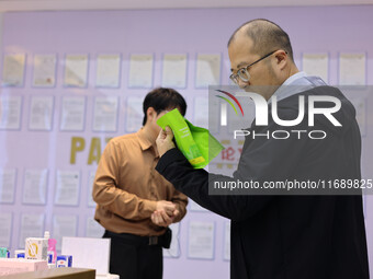 Visitors visit the Zhongyuan Food Laboratory at Luohe Vocational University of Food Engineering in Luohe, China, on October 21, 2024. (