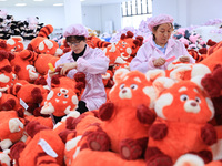 Workers rush to make plush toys for export at a toy company in Chengtou town, Ganyu district, Lianyungang, China, on October 21, 2024. (