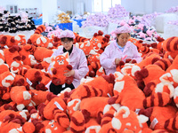 Workers rush to make plush toys for export at a toy company in Chengtou town, Ganyu district, Lianyungang, China, on October 21, 2024. (