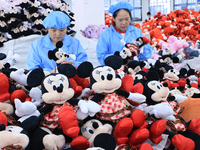 Workers rush to make plush toys for export at a toy company in Chengtou town, Ganyu district, Lianyungang, China, on October 21, 2024. (