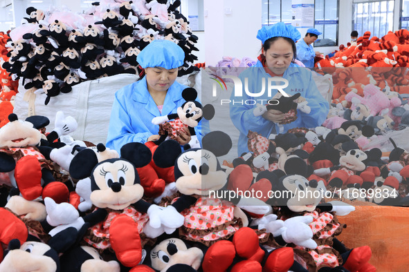 Workers rush to make plush toys for export at a toy company in Chengtou town, Ganyu district, Lianyungang, China, on October 21, 2024. 