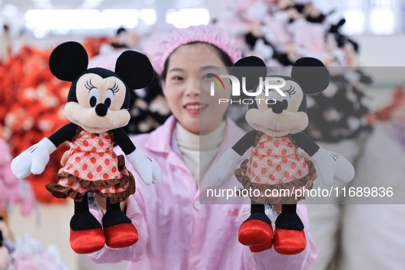 Workers rush to make plush toys for export at a toy company in Chengtou town, Ganyu district, Lianyungang, China, on October 21, 2024. 