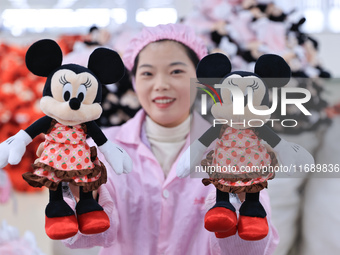 Workers rush to make plush toys for export at a toy company in Chengtou town, Ganyu district, Lianyungang, China, on October 21, 2024. (