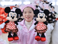 Workers rush to make plush toys for export at a toy company in Chengtou town, Ganyu district, Lianyungang, China, on October 21, 2024. (