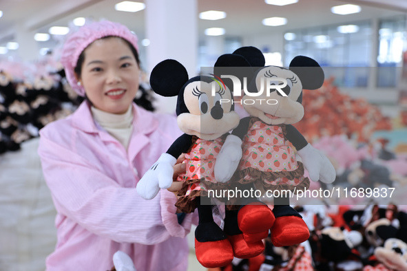 Workers rush to make plush toys for export at a toy company in Chengtou town, Ganyu district, Lianyungang, China, on October 21, 2024. 