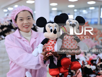 Workers rush to make plush toys for export at a toy company in Chengtou town, Ganyu district, Lianyungang, China, on October 21, 2024. (