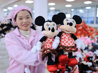 Workers rush to make plush toys for export at a toy company in Chengtou town, Ganyu district, Lianyungang, China, on October 21, 2024. (