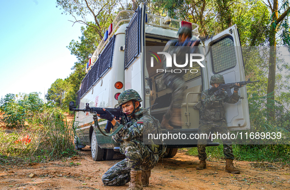 People's Armed Police conduct a mountain and forest combat drill in Qinzhou, China, on October 20, 2024. 