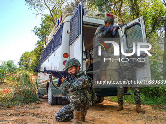 People's Armed Police conduct a mountain and forest combat drill in Qinzhou, China, on October 20, 2024. (