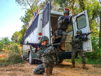 People's Armed Police conduct a mountain and forest combat drill in Qinzhou, China, on October 20, 2024. (