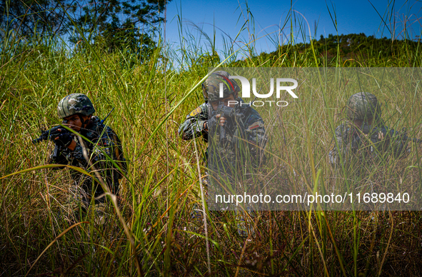 People's Armed Police conduct a mountain and forest combat drill in Qinzhou, China, on October 20, 2024. 