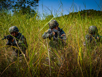 People's Armed Police conduct a mountain and forest combat drill in Qinzhou, China, on October 20, 2024. (