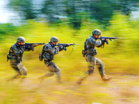 People's Armed Police conduct a mountain and forest combat drill in Qinzhou, China, on October 20, 2024. (