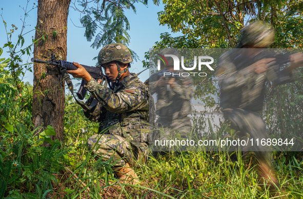 People's Armed Police conduct a mountain and forest combat drill in Qinzhou, China, on October 20, 2024. 