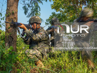 People's Armed Police conduct a mountain and forest combat drill in Qinzhou, China, on October 20, 2024. (