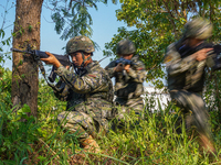 People's Armed Police conduct a mountain and forest combat drill in Qinzhou, China, on October 20, 2024. (