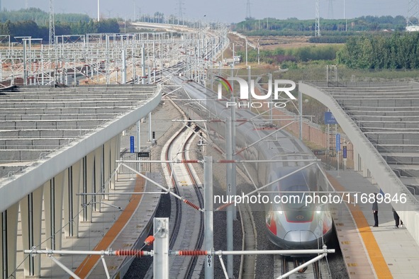 The first train of the Weifang-Yantai High-Speed Railway enters Laizhou Station in Shandong province in Yantai, China, on October 21, 2024. 