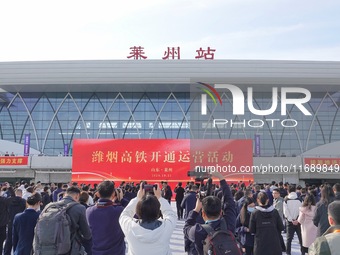 A ceremony to open the Weifang-Yantai High-speed Railway takes place at Laizhou Station in Shandong province in Yantai, China, on October 21...