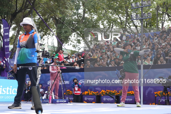 Deepika Kumari of India and Alejandra Valencia of Mexico compete during the women's recurve semifinals match on the final day of the Tlaxcal...