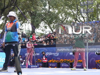 Deepika Kumari of India and Alejandra Valencia of Mexico compete during the women's recurve semifinals match on the final day of the Tlaxcal...