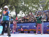 Deepika Kumari of India and Alejandra Valencia of Mexico compete during the women's recurve semifinals match on the final day of the Tlaxcal...