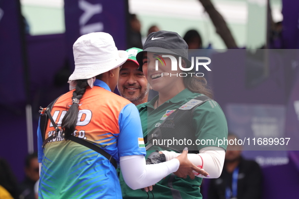 Deepika Kumari of India and Alejandra Valencia of Mexico compete during the women's recurve semifinals match on the final day of the Tlaxcal...