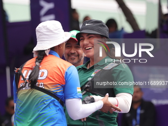 Deepika Kumari of India and Alejandra Valencia of Mexico compete during the women's recurve semifinals match on the final day of the Tlaxcal...