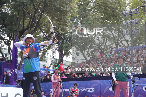 Deepika Kumari of India and Alejandra Valencia of Mexico compete during the women's recurve semifinals match on the final day of the Tlaxcal...